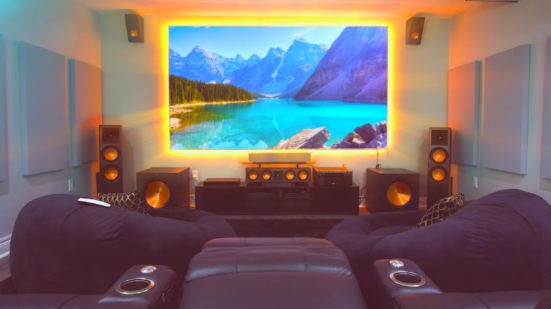 "A home theater room with dimmer lighting and sound-absorbing materials for optimal audio and video quality"